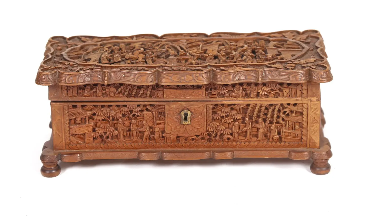 A wooden box with carvings on it.