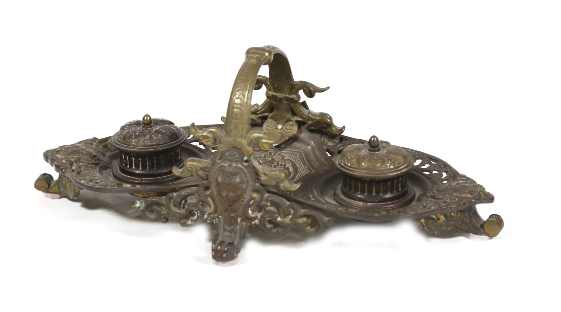 A bronze inkwell with two ink pots and a bird.