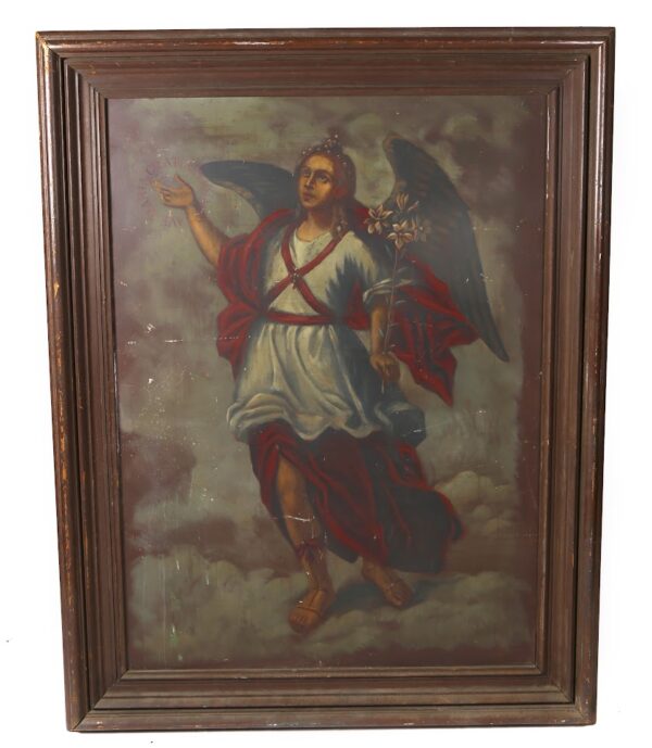 A painting of jesus is in a wooden frame.
