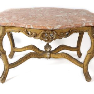 A marble top table with gold colored legs.