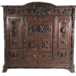 A large wooden cabinet with carvings on it.