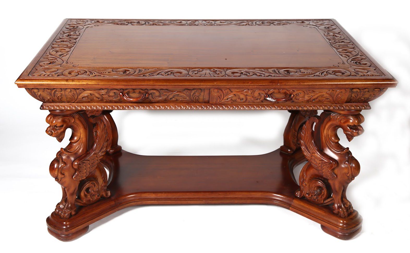A wooden table with carved designs on it.