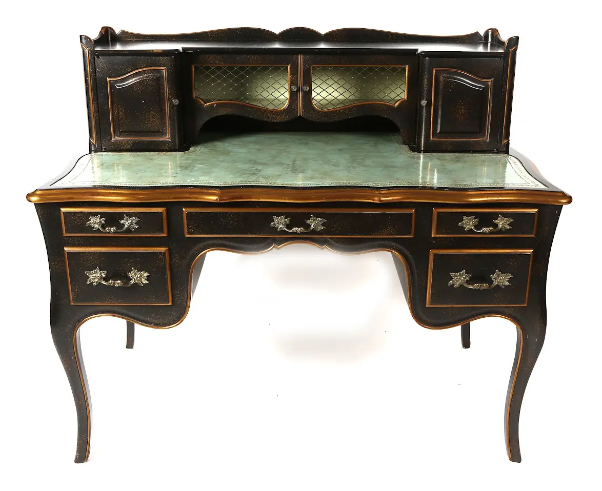 A desk with two drawers and a large mirror.