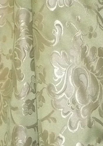 A close up of the fabric with floral designs