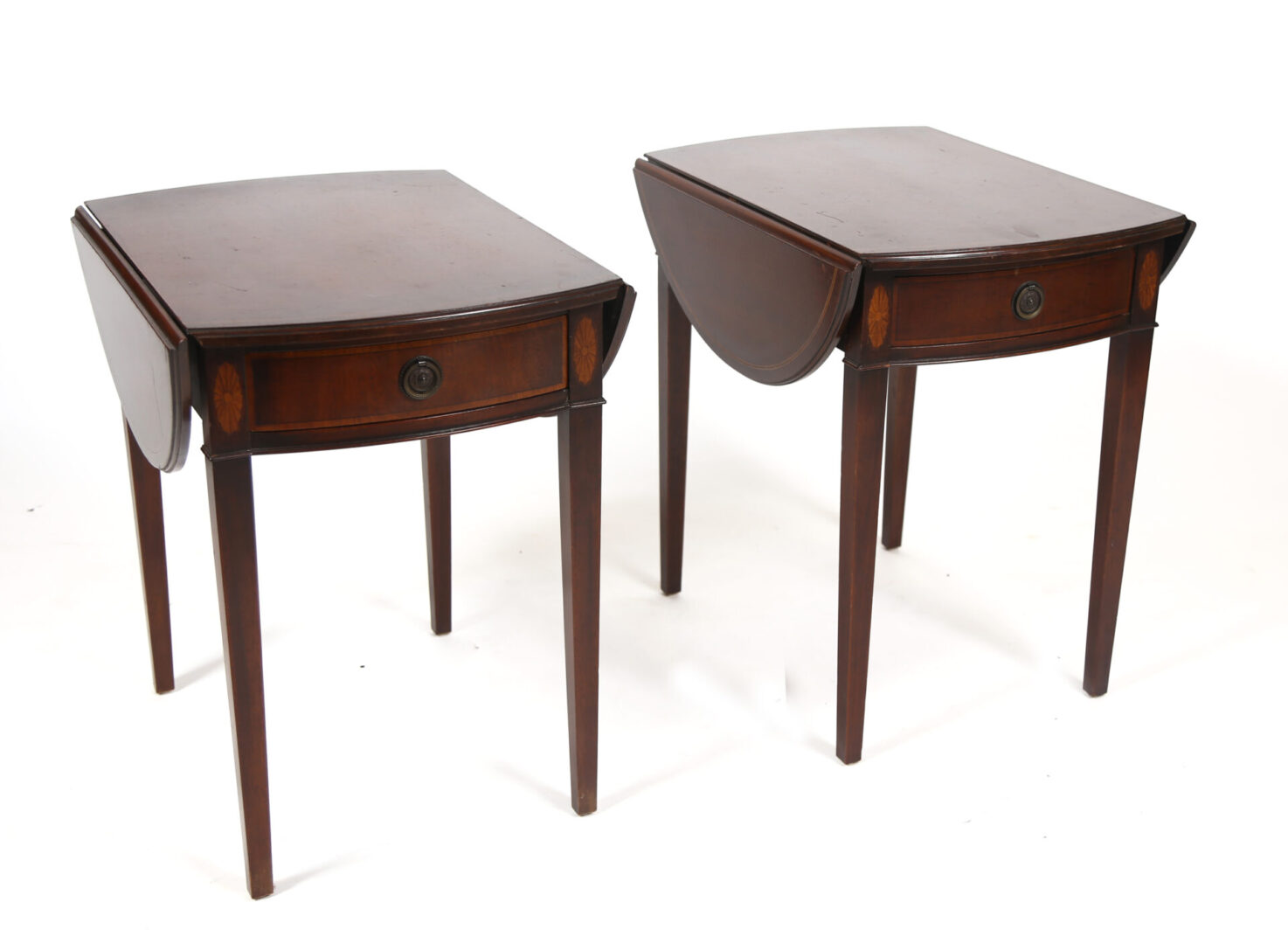 A pair of tables with one drawer and two legs.