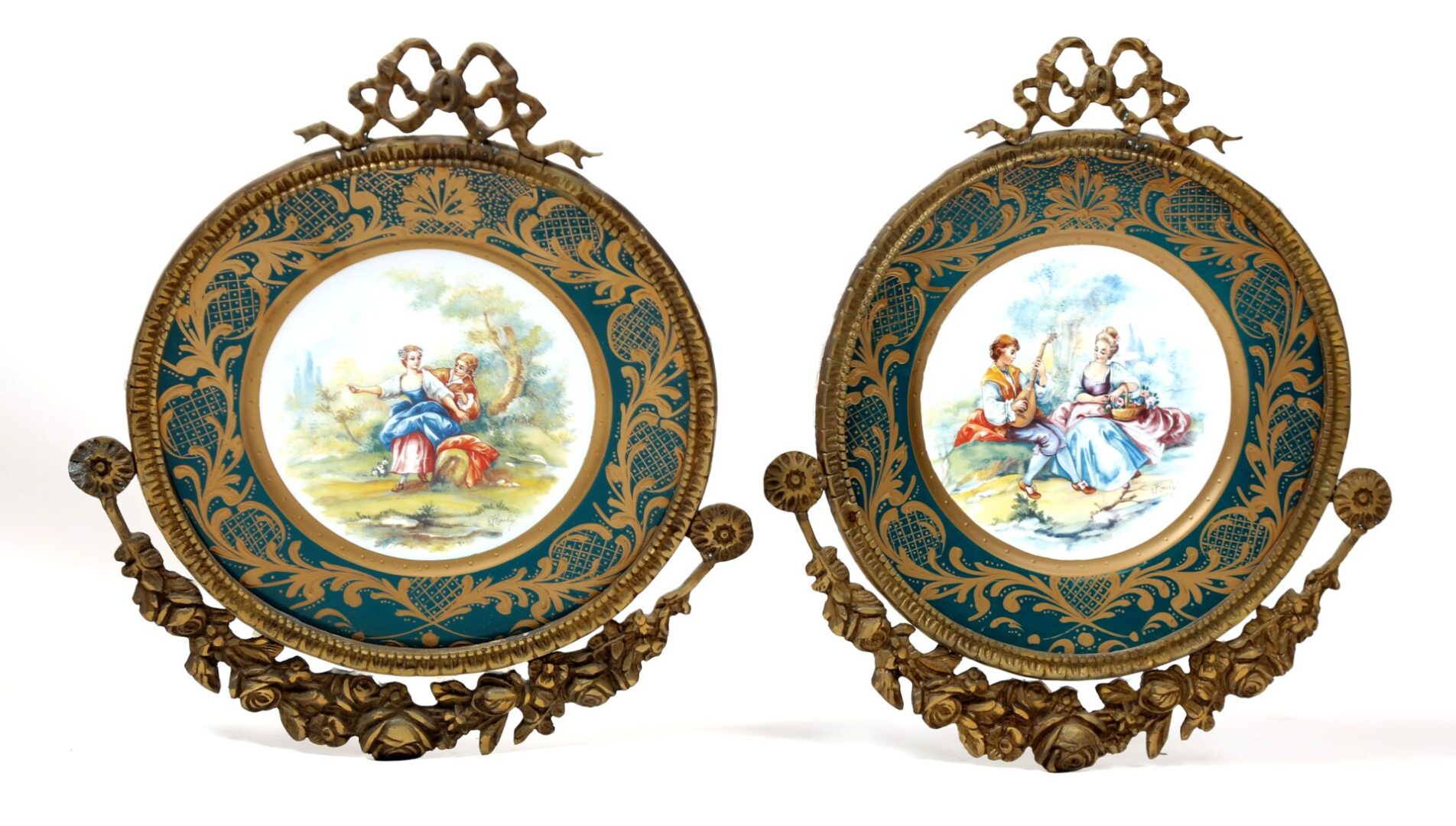 A pair of antique french porcelain plaques with bronze frames