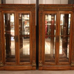 A pair of large display cabinets with glass doors.