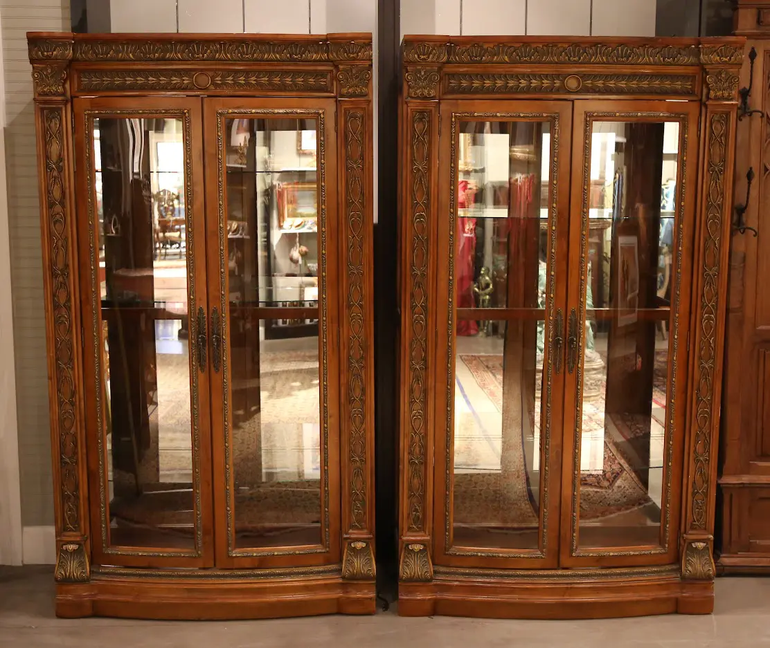A pair of large display cabinets with glass doors.