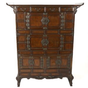 A large wooden cabinet with metal accents on the front.