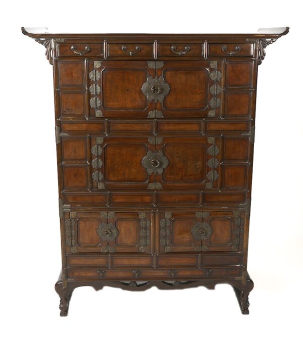 A large wooden cabinet with metal accents on the front.