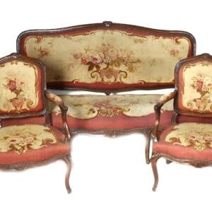 Antique floral patterned sofa and chairs.