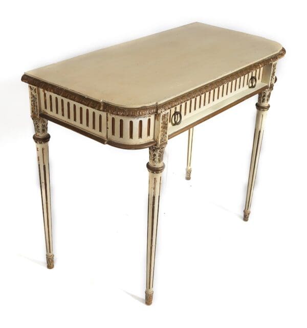 Ornate white and gold writing desk.