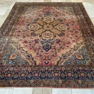 Ornate Persian rug on a tiled floor.