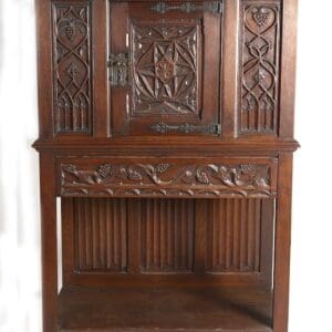 Ornate antique wooden cabinet with carvings.