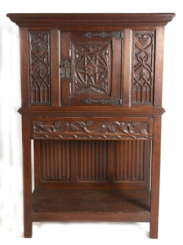 Ornate antique wooden cabinet with carvings.