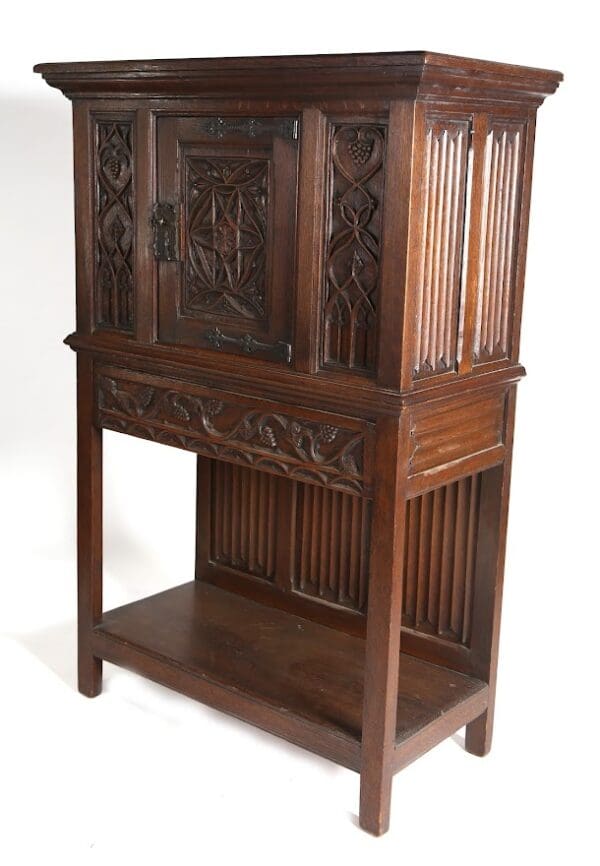 Ornate wood cabinet with carved details.