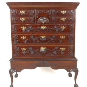 Antique carved mahogany chest of drawers.