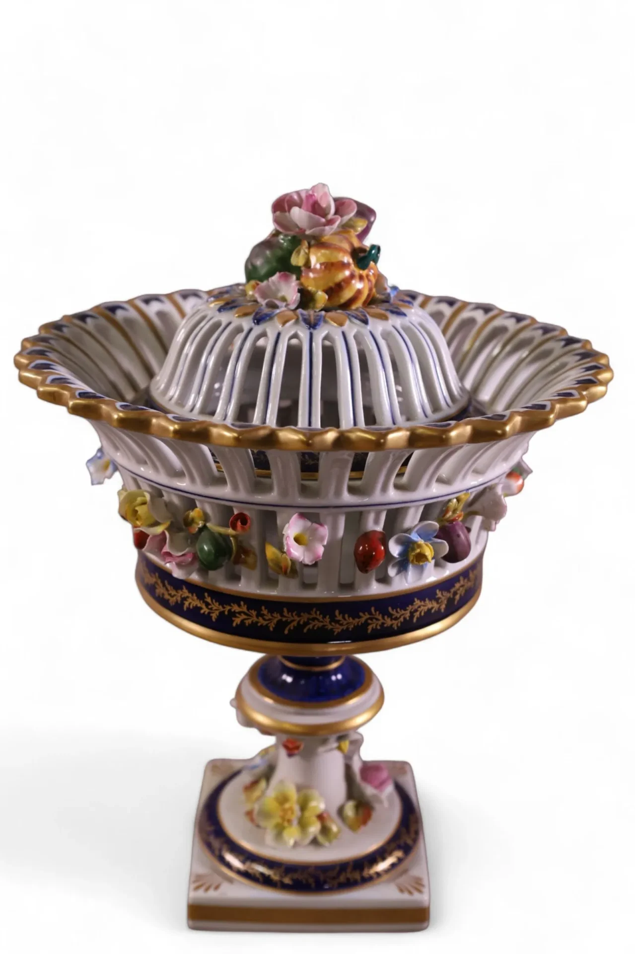 Ornate porcelain fruit basket with lid.