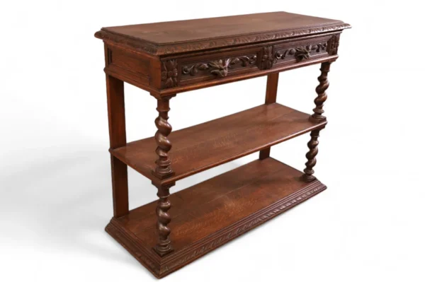 Ornate wooden console table with drawers.