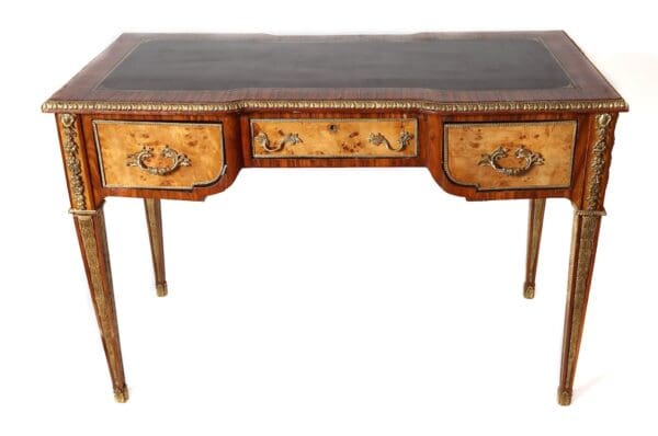 Antique wooden desk with ornate details.