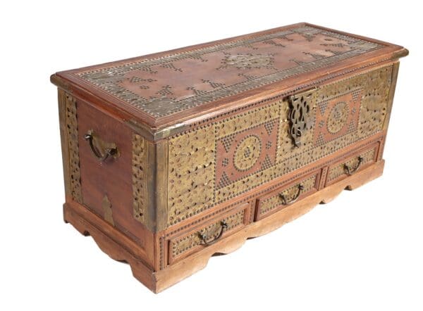Ornate wooden chest with brass inlay.