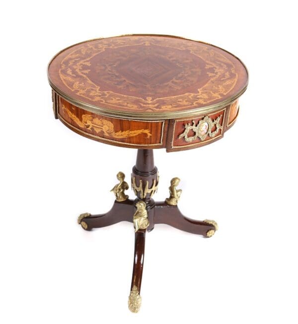 French Antique table with inlaid woods, and serves porcelain plaques inset