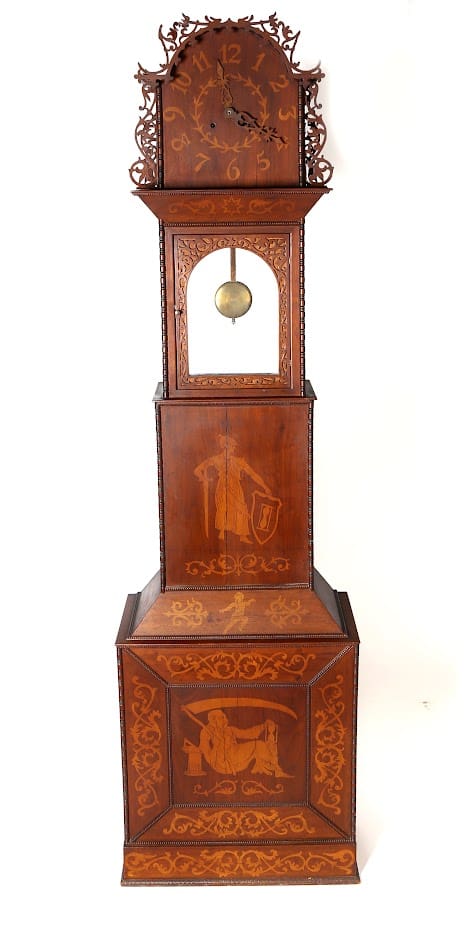 Ornate wooden grandfather clock with figures.