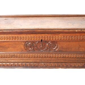 Ornate wooden chest with carved details.