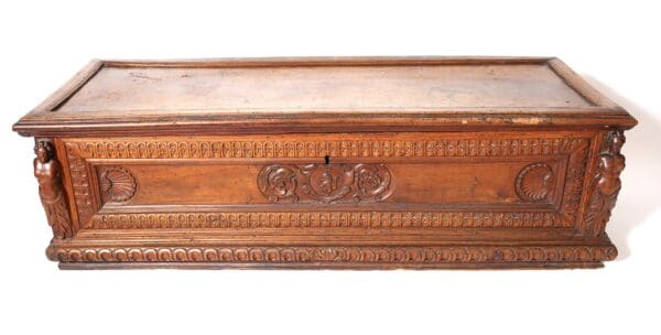 Ornate wooden chest with carved details.