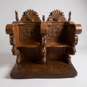 Ornate wooden bench with intricate carvings.