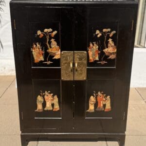 Antique Chinese lacquer cabinet adorned with inlay hardstone appliqués