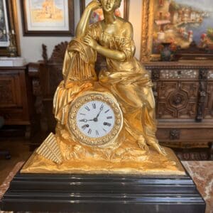 Antique French Gilt Neo-Classical Figural Clock on ebonized wooden Base