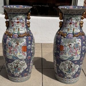 Two ornate, decorative vases with detailed patterns.