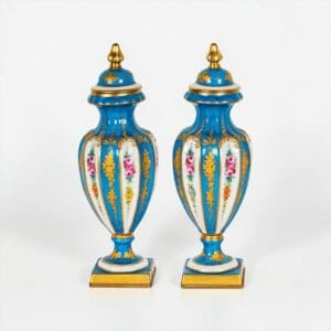 Pair of Antique French Sèvres-style hand painted porcelain lidded urns