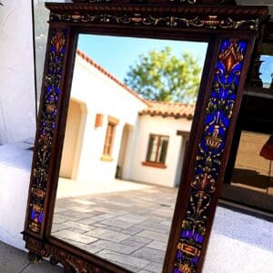 Exceptional 67 inch antique carved mirror with polychrome cobalt blue, gold, terracotta and green classical ornament at The Chapman Collection
