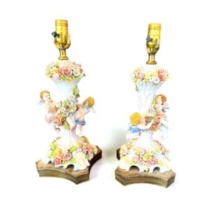 Pair of antique Dresden porcelain lamps with hand-applied porcelain flowers and winged cherub figures at The Chapman Collection