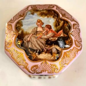 Antique Sèvres style porcelain box and octagonal pink porcelain curiosity chest with hand-painted romantic pastoral courtship scene and gilt lattice border