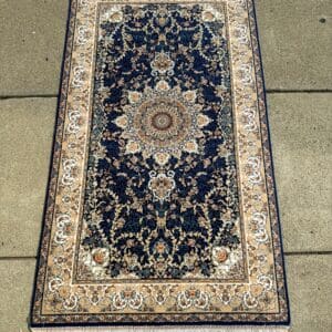 New Persian hand-finished Silk Qum carpet, 4'7" x 2'8", with a rich deep-blue field, intricate central medallion and ivory border at The Chapman Collection