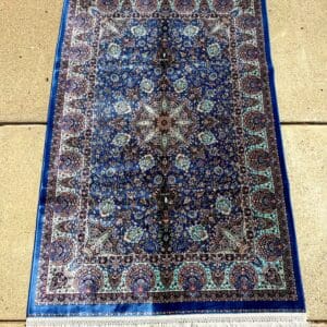 Persian hand-finished Silk Qum carpet, 3'11" x 2'7", in rich royal blue with turquoise accents and an intricate central medallion at The Chapman Collection