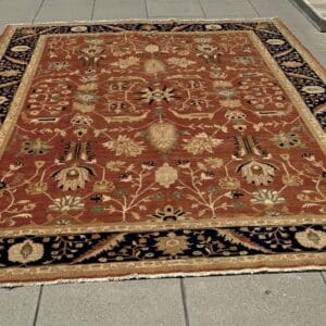 Large Handmade Pure Wool Carpet with all over design in burnt amber & navy