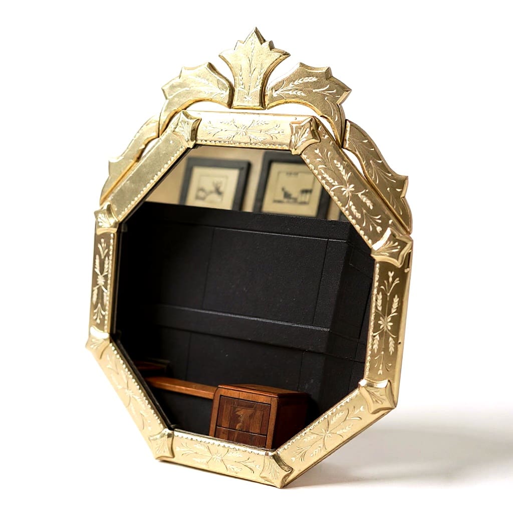 Three-quarter angle view of hand-etched Venetian glass mirror showing beveled glass frame and etched floral detailing