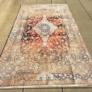 Persian hand-finished Silk Qum carpet, 9'10" x 6'5", in warm red, ivory and soft neutrals with central medallion and bird motifs in natural daylight at The Chapman Collection
