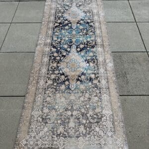 Persian hand-finished Silk Qum runner, 9′10″ × 3′3″, in navy, turquoise and warm taupe with ivory scrollwork and paired medallions