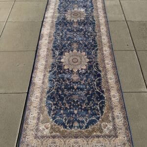 New Persian hand-finished Silk Qum runner, 10′ × 3′3″, with midnight-blue tones, ivory medallions and intricate scrolling detail